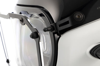 Wunderlich foldable “CLEAR” headlight guard - black